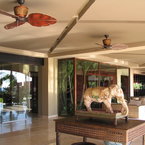 Treventi ceiling fan, in tropical-colonial style, rust finish with handcarved wooden blades