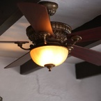 Ventana ceiling fan, sedona beige finish, with wooden blades and amber glass bowl in colonial style
