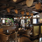 Punkah ceiling fan in tropical-colonial style, antique brass with natural palm leaf blades, Raffles Hotel Singapore